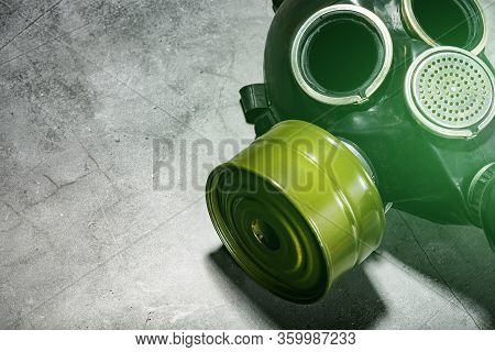 Gas Mask On A Black Stone Background, Protection From Dangerous Infection.