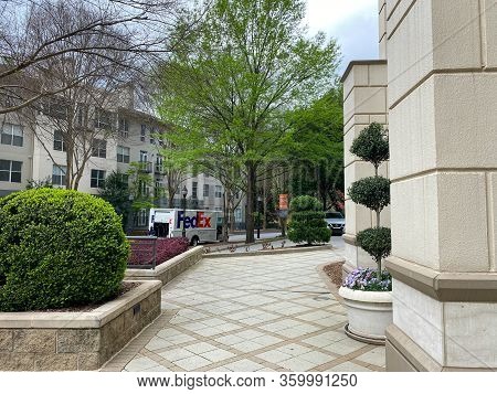 Atlanta, Ga/usa-3/21/20:  A Fedex Truck Delivering Package To Condominiums And Corporate Buildings I