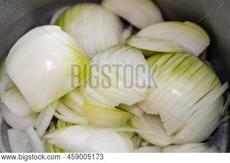 Cutted Onions Placed In A Pan To Cook An Onion Tart.