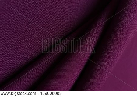 Purple Crumpled Or Wavy Fabric Texture Background. Abstract Linen Cloth Soft Waves. Gabardine Wool F