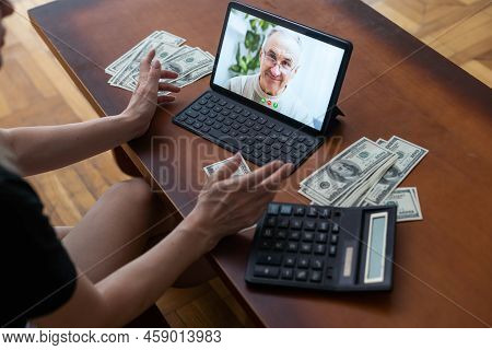 Tablet Screen And Lot Of Hundred Dollar Bills. Business And Social Networking Concept