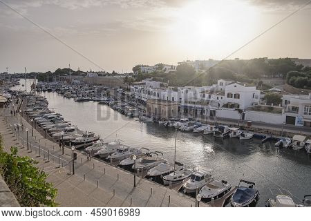 Sunset In A Marina Of A Mediterranean Village Seen From Above, With Boats And Yatchs Moored In A Sea