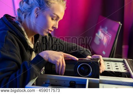 Close-up Of Gamer Girl Installing New Gpu Video Card In Her Gaming Pc