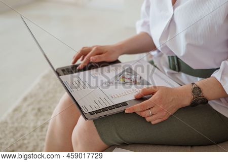 Tver, Russia-august 7, 2022. A Woman With A Laptop Is Studying Human Design. The Concept Of Studying