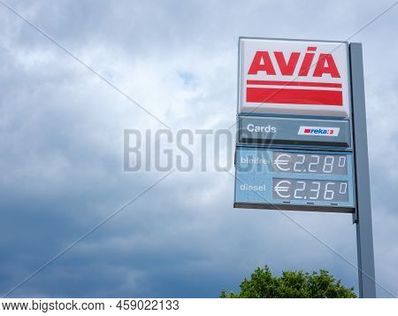 Basel, Switzerland - July 4 2022: Avia Sign At Gas Station Against Cloudy Sky. With Around 3, 000 Fi