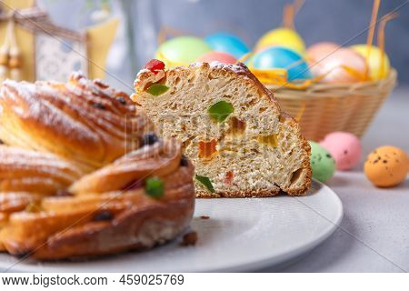 Craffin (cruffin) With Raisins And Candied Fruits. Traditional Easter Bread Kulich And Painted Eggs 