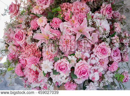 Big Bouquet Of Flowers In A Vase On A Gray Wall Background