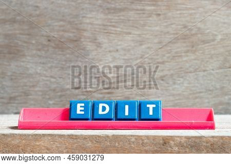 Tile Letter On Red Rack In Word Edit On Wood Background