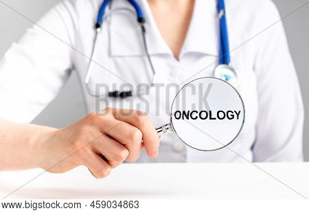 Oncology Word. Cancer Text In Doctor Hands. High Quality Photo