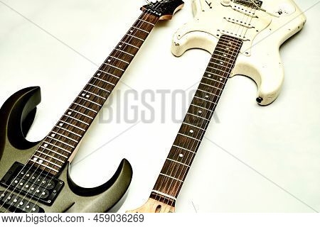 Two Guitar, Neck Fretboard On A White Background.black, White, Brown.