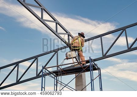A Workers Are Using Inverter Welding Machine. Equipment For Welding Both Ferrous And Non-ferrous Met