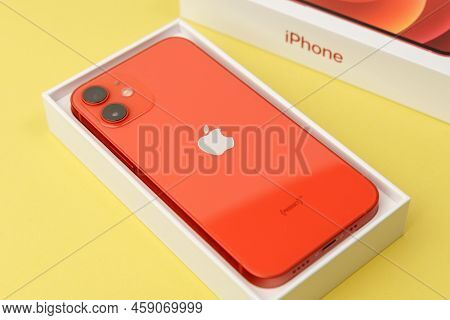 Tyumen, Russia-july 18, 2022: Iphone 12 Mini Product Red. This Mobile Phone Records 4k Video In Dolb
