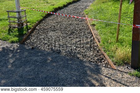 Preparation For Road Renovation. The Removed Rock Formation Is Replaced By A New One. Warning Safety