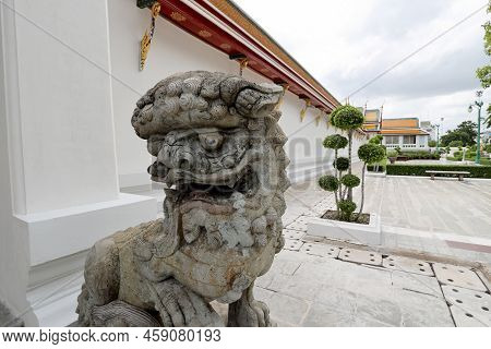 Bangkok, Thailand - July 9, 2022: The Stone Lion Statue Located In Wat Suthat Thepwararam Ratchawora