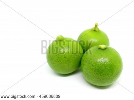 Closeup Three Of Vibrant Green Key Limes On White Background
