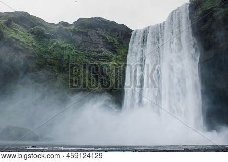 Scogafoss Waterfall In Iceland. Travel Summer Nordic Concept. Natural Icelandic Background.