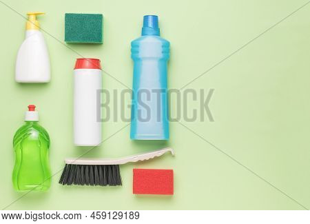 Cleaning Products For Cleaning And A Brush On A Light Background. A Place For Your Text. Cleaning Ki