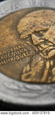 Translation: Republic Of Chile. Coin Of 500 Chilean Pesos Closeup. Peso Of Chile. News About Economy