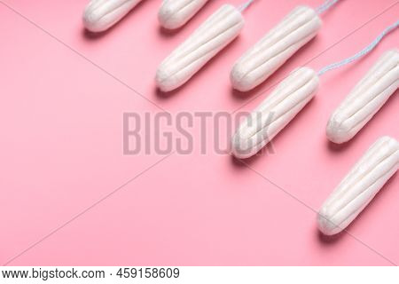 Medical Female Tampon On A Pink Background. Hygienic White Tampon For Women. Cotton Swab. Menstruati