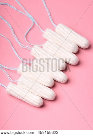 Medical Female Tampon On A Pink Background. Hygienic White Tampon For Women. Cotton Swab. Menstruati