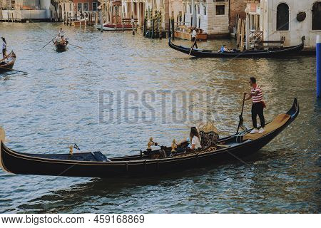Italy. Venice. 09.07.2022 Venice Grand Canal. People Float On Gondolas. City View, Travel
