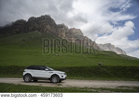 Range Rover Evoque Car On The Background Of The Mountains Of The North Caucasus In Russia. Cloudy Da
