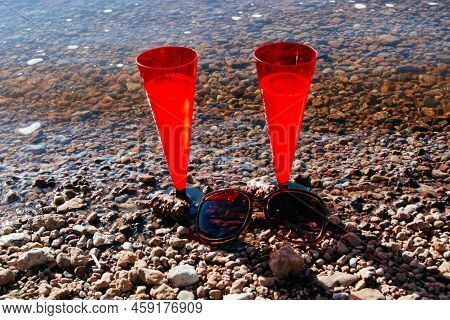 In Summer, Two Red Glasses Of Sparkling Champagne Or Prosecco