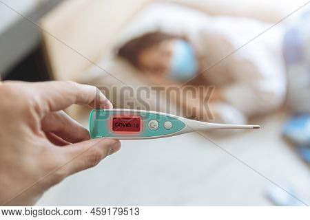 Closeup Hand Show Coronavirus Flu Detector Device Display Show Results And Identify Covid-19 Patient