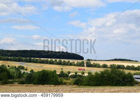 Eifel Landscape With Ripe Fields And Truck Parking