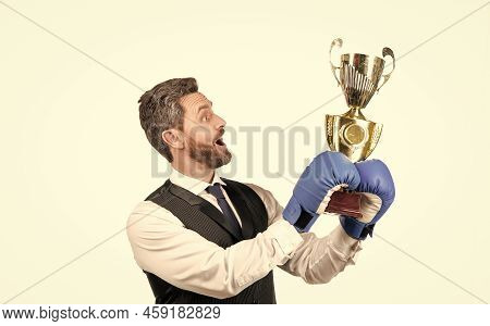 Businessman In Boxing Gloves With Trophy. Successful Ceo Boxer. Relentless Struggle And Success