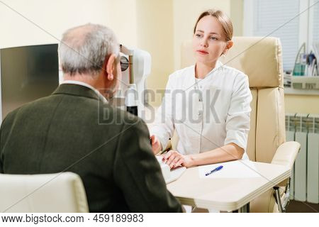 Ophthalmologist Examination Of Elderly Man On Corneo Topographer.modern Clinic