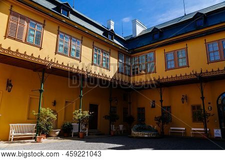 Slatinany, Czech Republic, 17 April 2022: Classical Chateau Or Romantic Yellow Castle Surrounded By 