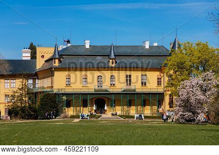 Slatinany, Czech Republic, 17 April 2022: Classical Chateau Or Romantic Yellow Castle Surrounded By 