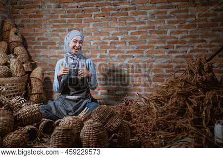 Craftswoman In Veil With Thumbs Up Among Woven Water Hyacinth