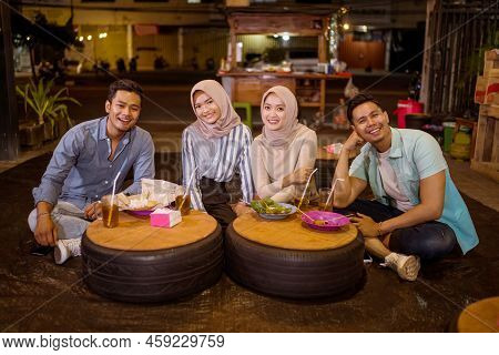 Happy Muslim Friend Enjoy Having Iftar Dinner