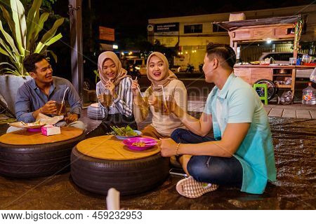 Happy Muslim Friend Enjoy Having Iftar Dinner