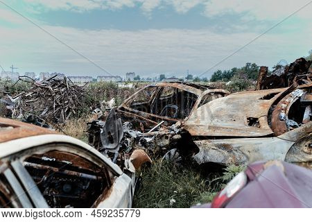 Consequences Of The War In Ukraine - Destroyed Cars In Irpin, Bucha District.
