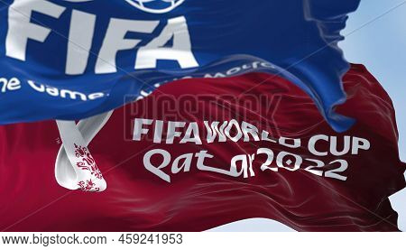 Doha, Qatar, January 2022: Flags With Fifa And Qatar 2022 World Cup Logo Waving In The Wind. The Eve
