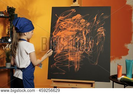 Small Artist Painting Masterpiece With Orange Color, Using Colormix Tray With Aquarelle Dye To Paint
