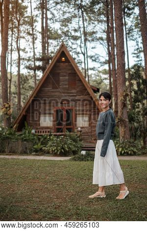 Happy Woman In Sweater Traveling In Pine Tree Forest, Tourist Visit At Doi Bo Luang, Chiang Mai, Tha