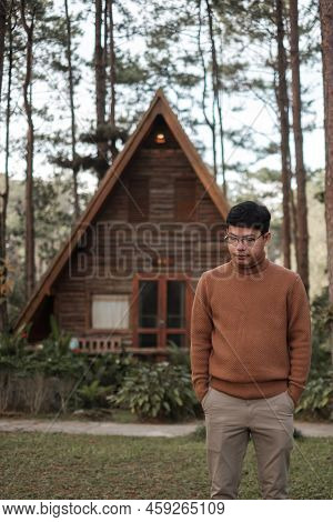 Happy Man In Sweater Traveling In Pine Tree Forest, Tourist Visit At Doi Bo Luang, Chiang Mai, Thail