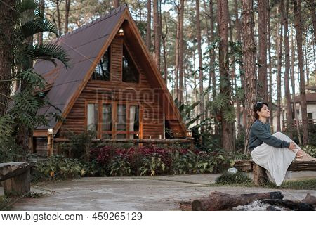 Happy Woman In Sweater Traveling In Pine Tree Forest, Tourist Visit At Doi Bo Luang, Chiang Mai, Tha