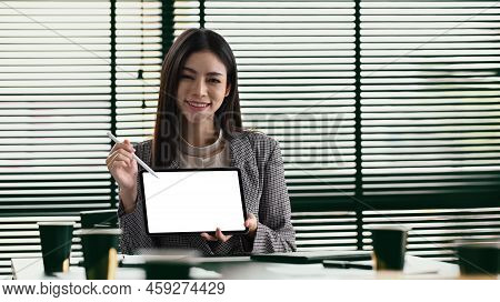 Gorgers Female Entrepreneur Holding And Showing Digital Tablet. Empty Screen For Your Advertise Text