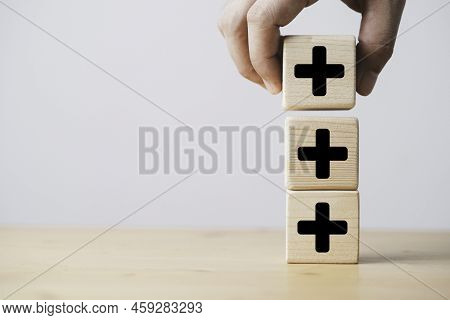 Hand Stacking Plus Sign Which Print Screen On Wooden Cube Block For Addition And Positive Mindset Th