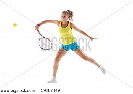 Dymanic Portrait Of Sportive Woman, Professional Tennis Player In Motion, Training Isolated Over Whi