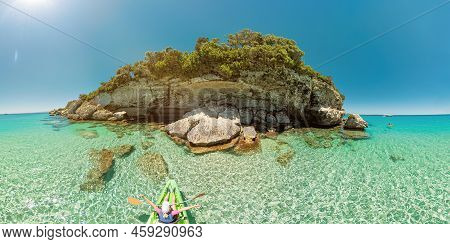 Aerial Drone View Of Woman Kayaking In The Mediterranean Sea By Piana Island. Top View Kayak In The 