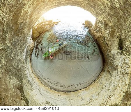 Aerial View Interior Of The Cave Of Petit Sperone Beach With Kayak. Drone View In The Mediterranean 