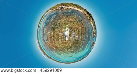 Tiny Planet 360 View Of Kayak From Piantarella Beach. Aerial View Of Piana Island In Corsica Of Fran