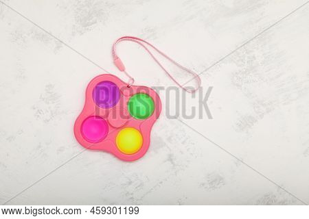 Push Pop Fidget Toy (simple Dimple, Pop It) On Light Grey Background. Top View, Copy Space.