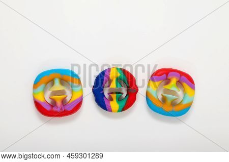 Three Children's Toys That Develop Fine Motor Skills. Fashionable Silicone Toys Snapperz On Light Ba